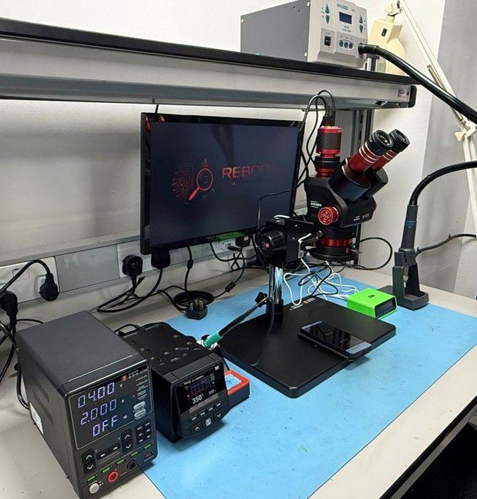 Reboot repair training workbench at the Leeds training facility, with stereo microscope, soldering station, bench power supply and hot air rework station